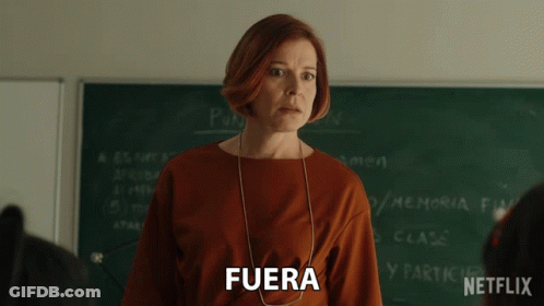 Woman In Front Of Blackboard With Fuera GIF