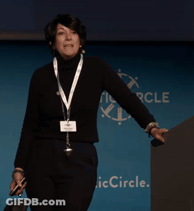 Woman In Front Of Blue Wall Saying Circle GIF