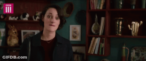 Woman In Front Of Bookshelf With BBC GIF