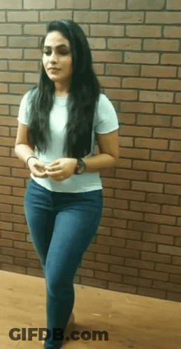 Woman In Front Of Brick Wall GIF