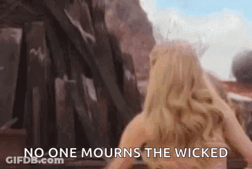Woman In Front Of Building Saying No One Mourns The Wicked GIF