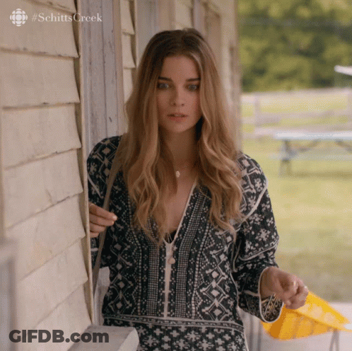 Woman In Front Of Building Schitts Creek GIF