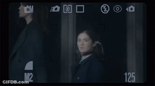 Woman In Front Of Camera Saying 125 GIF