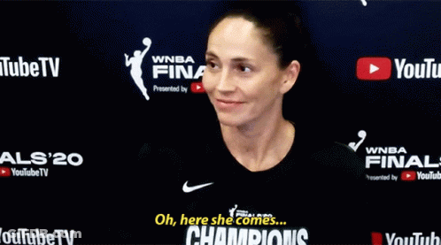Woman In Front Of Champions Sign GIF