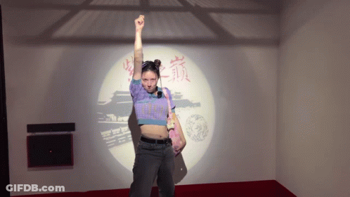 Woman In Front Of Chinese Writing Wall GIF