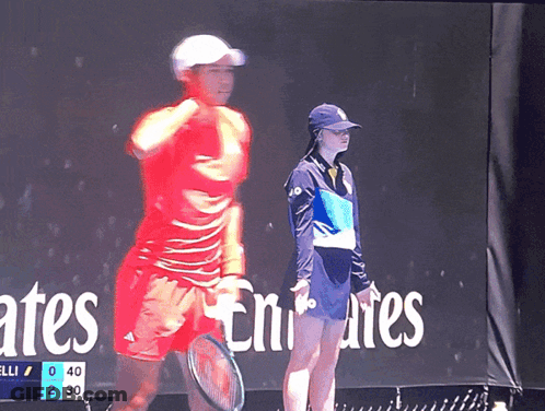 Woman In Front Of Emirates Sign GIF