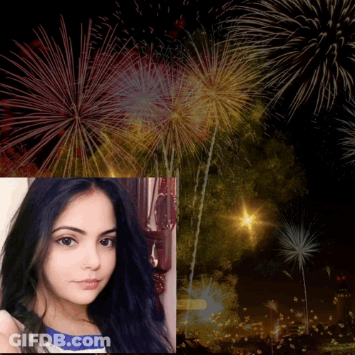 Woman In Front Of Fireworks GIF