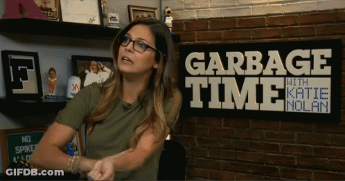 Woman In Front Of Garbage Time With Katie Molan Sign GIF