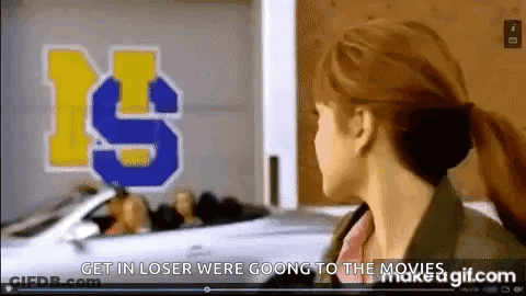 Woman In Front Of Get In Loser Were Going To The Movies Sign GIF