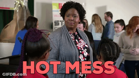 Woman In Front Of Group Saying Hot Mess GIF