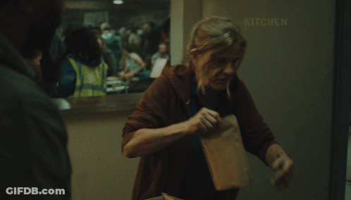 Woman In Front Of Kitchen Sign GIF