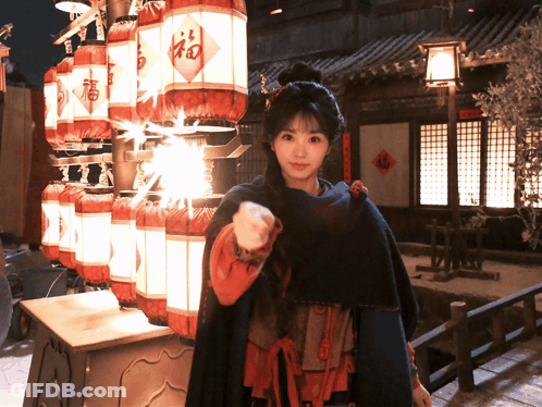 Woman In Front Of Lanterns With Fu GIF