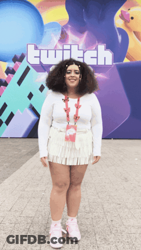 Woman In Front Of Large Twitch Sign GIF