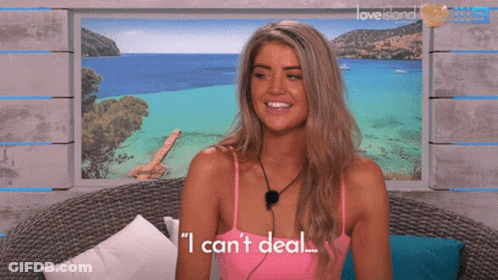 Woman In Front Of Love Island Poster GIF