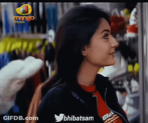 Woman In Front Of Mango Music Sign GIF