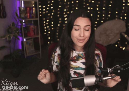 Woman In Front Of Microphone With Kiiger GIF