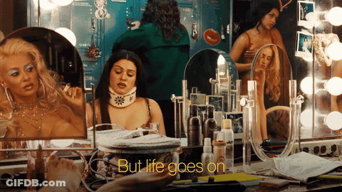 Woman In Front Of Mirror Saying But Life Goes On GIF