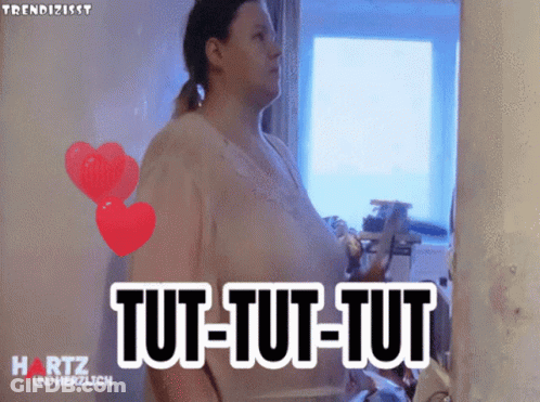 Woman In Front Of Mirror Saying Tut-Tut-Tut GIF