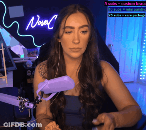 Woman In Front Of Neon Novel Sign GIF