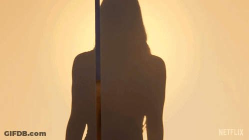 Woman In Front Of Netflix Logo GIF
