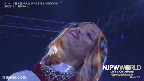 Woman In Front Of NJpwworld Live And On-Demand Sign GIF