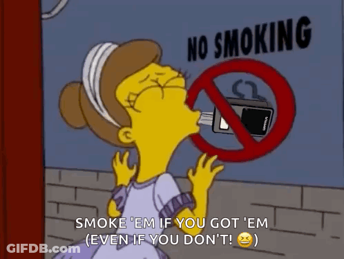 Woman In Front Of No Smoking Sign GIF