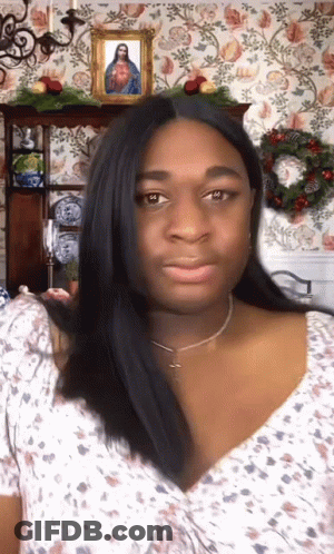 Woman In Front Of Picture Of Jesus GIF