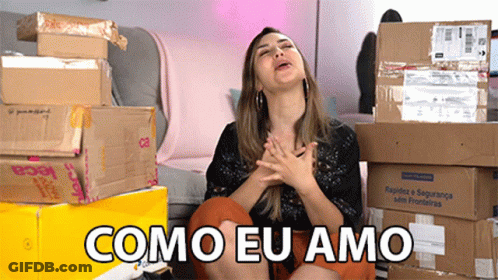 Woman In Front Of Pile Of Boxes Como Eu Amo GIF