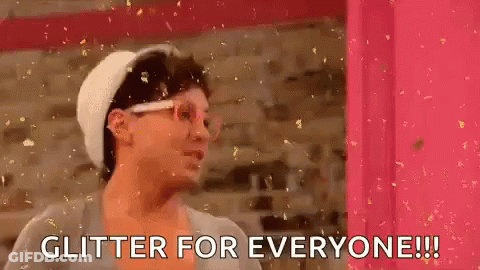 Woman In Front Of Pink Wall Saying Glitter For Everyone GIF
