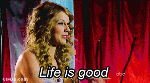 Woman In Front Of Red Curtain Saying Life Is Good GIF