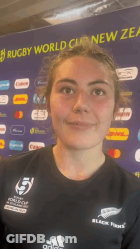 Woman In Front Of Rugby World Cup Banner GIF