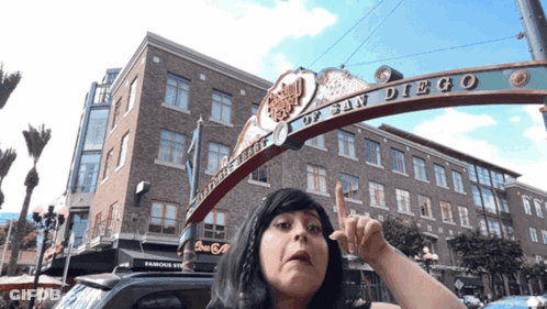 Woman In Front Of San Diego Sign GIF