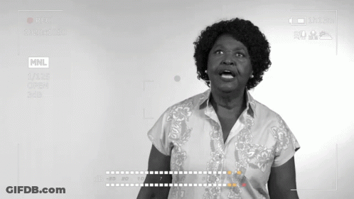 Woman In Front Of Screen Saying MNL GIF