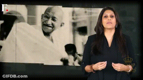 Woman In Front Of Screen With Mahatma Gandhi GIF