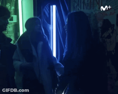 Woman In Front Of Sign M + GIF