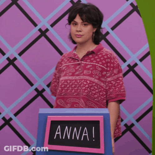 Woman In Front Of Sign Saying Anna GIF