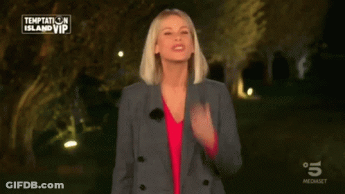 Woman In Front Of Temptation Island VIP Sign GIF