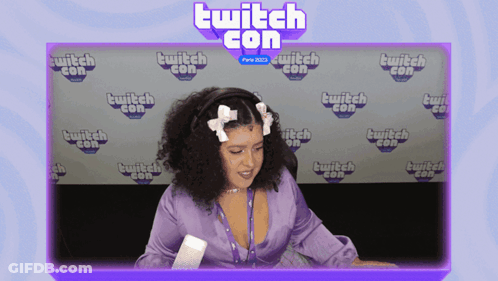 Woman In Front Of Twitch Con Background GIF