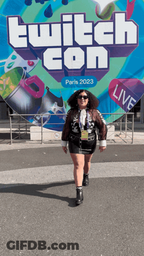 Woman In Front Of Twitch Con Paris 2023 Sign GIF