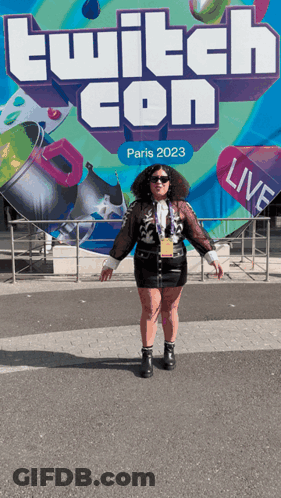 Woman In Front Of Twitch Con Sign GIF