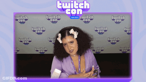 Woman In Front Of Twitch Con Wall GIF