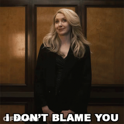 Woman In Front Of Wall Saying I Don't Blame You GIF