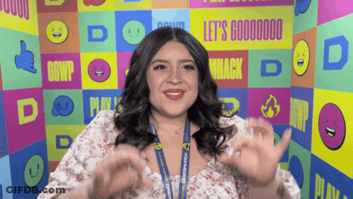 Woman In Front Of Wall Saying Let's Goooooo GIF