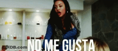 Woman In Front Of Wall Saying No Me Gusta GIF