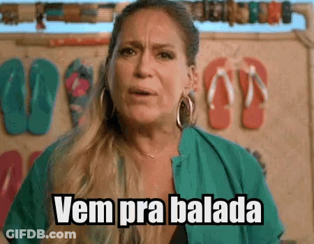 Woman In Front Of Wall With Flip Flops Says Vem Pra Balada GIF