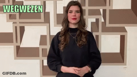 Woman In Front Of Wegweisen Wall GIF