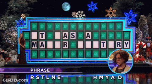 Woman In Front Of Wheel Of Fortune RSTLNE HMYAD GIF