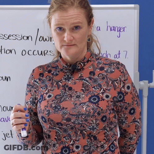 Woman In Front Of White Board Saying Hanger GIF