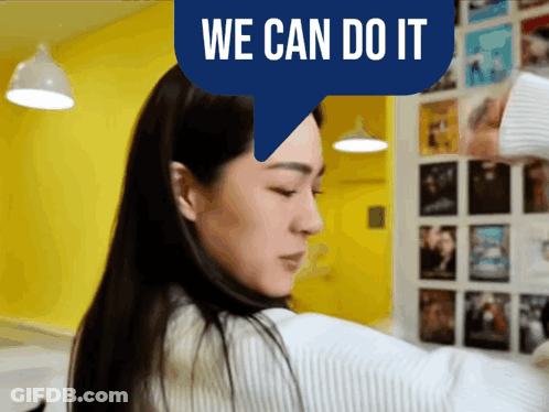 Woman In Front Of Yellow Wall Saying We Can Do It GIF