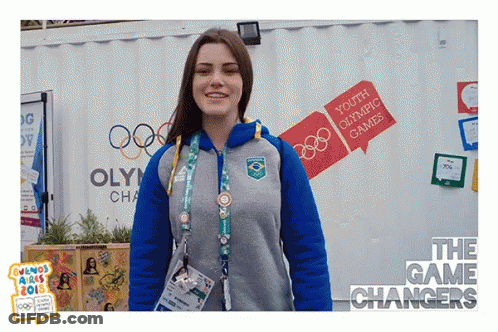Woman In Front Of Youth Olympic Games Building GIF